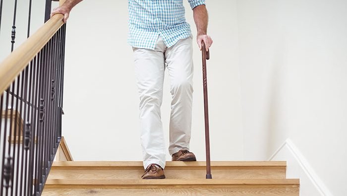 man-walking-stairs-cane